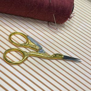 Vintage gold and silver tone crane/stork embroidery scissors 3 1/2"